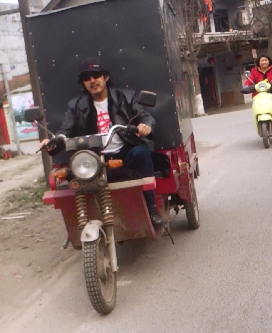 Abraham Lincoln Lim drives 'Love Machine' equipment tricycle, Tongxian, China 2015
